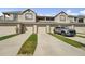 Exterior townhome view showing lawn and driveway at 6040 Fishhawk Crossing Blvd # 6040, Lithia, FL 33547