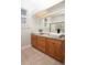 Bathroom featuring double vanity sinks with a granite countertop and square vessel sinks at 6222 Kingbird Manor Dr, Lithia, FL 33547