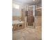 Bathroom featuring soaking tub and frameless shower at 6222 Kingbird Manor Dr, Lithia, FL 33547