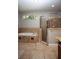 Bright bathroom featuring a soaking tub, glass shower, and tiled flooring at 6222 Kingbird Manor Dr, Lithia, FL 33547