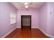 Bedroom with light purple walls and a closet at 6222 Kingbird Manor Dr, Lithia, FL 33547