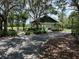 Community covered pavilion with outdoor seating and beautiful green surroundings at 6222 Kingbird Manor Dr, Lithia, FL 33547