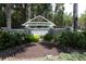 Stone community sign surrounded by lush green landscaping at 6222 Kingbird Manor Dr, Lithia, FL 33547