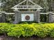 Stone community sign with lush green landscaping surrounding it at 6222 Kingbird Manor Dr, Lithia, FL 33547