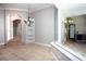 Dining room features a decorative chandelier and a large window for natural light at 6222 Kingbird Manor Dr, Lithia, FL 33547