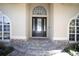 Inviting front entrance showcasing a beautiful door with sidelights and stone accents at 6222 Kingbird Manor Dr, Lithia, FL 33547