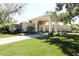 Beautiful single-story home features a long driveway and mature landscaping with stone accents at 6222 Kingbird Manor Dr, Lithia, FL 33547