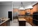 Kitchen featuring stainless steel appliances, granite countertops and breakfast bar at 6222 Kingbird Manor Dr, Lithia, FL 33547