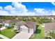 Aerial view of the property, featuring a well-manicured lawn in a neighborhood setting at 6307 113Th E Ter, Parrish, FL 34219