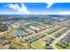 A scenic aerial view of a neighborhood featuring lush landscaping, serene ponds and well-maintained homes at 6307 113Th E Ter, Parrish, FL 34219