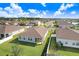 Aerial view of a home with a well-maintained lawn in a neighborhood with multiple homes at 6307 113Th E Ter, Parrish, FL 34219