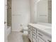 Well-lit bathroom featuring neutral colors, sleek vanity, and a tiled shower at 6307 113Th E Ter, Parrish, FL 34219