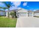 Lovely home boasting a three-car garage, lush landscaping and a well-kept lawn at 6307 113Th E Ter, Parrish, FL 34219