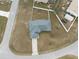 Aerial shot of a cozy home featuring an asphalt shingle roof, a concrete driveway, and an empty yard at 7056 Landover Blvd, Spring Hill, FL 34608