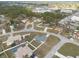 Aerial view of a quiet residential neighborhood showcasing well-kept homes and tree-lined streets at 7056 Landover Blvd, Spring Hill, FL 34608