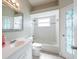 Bright bathroom features stylish mirror, shower, and vanity at 7056 Landover Blvd, Spring Hill, FL 34608