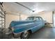 Spacious garage featuring a vintage vehicle at 7056 Landover Blvd, Spring Hill, FL 34608