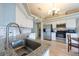 Kitchen featuring stainless steel appliances, a granite countertop island, and a dining area and modern lighting at 7056 Landover Blvd, Spring Hill, FL 34608