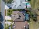 An aerial view of this lovely home showcasing a sparkling swimming pool at 7284 Pebble Beach Ln, Seminole, FL 33777