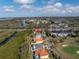 A high angle showcasing the property's serene setting near a golf course at 7284 Pebble Beach Ln, Seminole, FL 33777