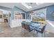 A dining room with skylights and a view of the backyard through a large window at 7284 Pebble Beach Ln, Seminole, FL 33777