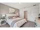 Cozy bedroom featuring neutral tones, ample natural light, and stylish side tables at 7804 Wheat Stone Dr, Zephyrhills, FL 33540