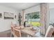 Bright dining area featuring sliding glass doors to the backyard at 7804 Wheat Stone Dr, Zephyrhills, FL 33540