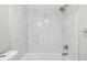 The bathroom features a tiled shower over tub at 8408 Bob Wiggs Ave, Lithia, FL 33547