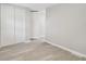 Bedroom with gray walls, gray flooring, and a closet at 8408 Bob Wiggs Ave, Lithia, FL 33547