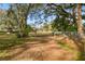 Green and grassy yard with privacy fence and access gate at 8408 Bob Wiggs Ave, Lithia, FL 33547