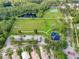 Aerial view of community park with a playground, parking, and sport fields at 8731 Boysenberry Dr, Tampa, FL 33635