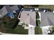 Overhead view of a home with a screened-in pool, well-kept lawn, and inviting curb appeal at 8731 Boysenberry Dr, Tampa, FL 33635