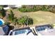 Beautiful aerial view of backyard pools and green space in a quiet neighborhood at 8731 Boysenberry Dr, Tampa, FL 33635