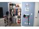 Organized bedroom closet with clothes, storage boxes, and shelves for shoes and other accessories at 8731 Boysenberry Dr, Tampa, FL 33635