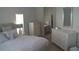 Serene main bedroom with ensuite bath features abundant natural light and neutral decor at 8731 Boysenberry Dr, Tampa, FL 33635