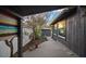 Charming backyard view with a gray wood plank deck, a white fence, and lovely shed at 939 Mandalay Ave, Clearwater Beach, FL 33767