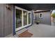 Relaxing covered patio with sliding glass doors that seamlessly connect indoor and outdoor living spaces at 939 Mandalay Ave, Clearwater Beach, FL 33767