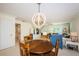 Dining Room featuring a wooden table and chairs and view to living room at 9940 69Th N St, Pinellas Park, FL 33782