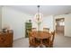 Cozy dining room showcases a wooden table set and unique orb chandelier at 9940 69Th N St, Pinellas Park, FL 33782