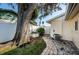 Paver path to bonus Florida room with white vinyl privacy fence at 9940 69Th N St, Pinellas Park, FL 33782