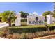 Community entrance sign for Ravinia surrounded by manicured landscaping and lush greenery at 11311 Ravinia Park Blvd, Tampa, FL 33625