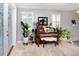 Bright living room with a piano, plantation shutters, and stylish decor at 11311 Ravinia Park Blvd, Tampa, FL 33625