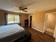 Spacious bedroom with a ceiling fan and large window letting in plenty of natural light at 13915 Village View Dr, Tampa, FL 33624