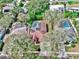 Aerial view of a single-Gathering home with a screened-in pool and solar panels on the roof at 140 Sage Cir, Crystal Beach, FL 34681