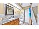 Well-maintained bathroom featuring stylish vanity, granite countertop, updated fixtures, and shower-tub combo at 140 Sage Cir, Crystal Beach, FL 34681