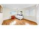 Cozy bedroom featuring a daybed, hardwood floors, a ceiling fan, and bright natural light at 140 Sage Cir, Crystal Beach, FL 34681