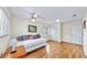 Comfortable bedroom with a daybed, ceiling fan, hardwood floors, and a window with bright natural light at 140 Sage Cir, Crystal Beach, FL 34681
