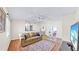 Inviting living room with a comfortable sofa, hardwood floors, and tv at 140 Sage Cir, Crystal Beach, FL 34681