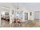 Open-concept living area featuring dining space, views of the pool, and comfortable seating at 140 Sage Cir, Crystal Beach, FL 34681