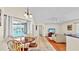 Open concept living area with view to the pool, and into the kitchen and living room spaces at 140 Sage Cir, Crystal Beach, FL 34681